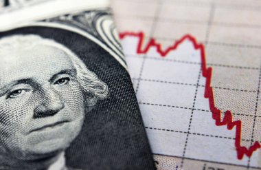 Stock market declining chart and US banknote