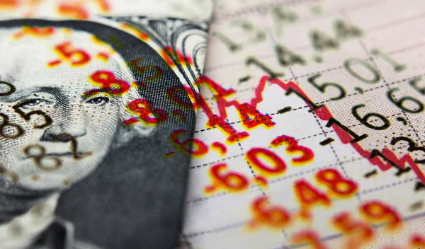 Stock market declining chart and US banknote
