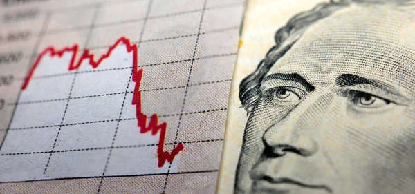 Stock market declining chart and US banknote — Stockfoto