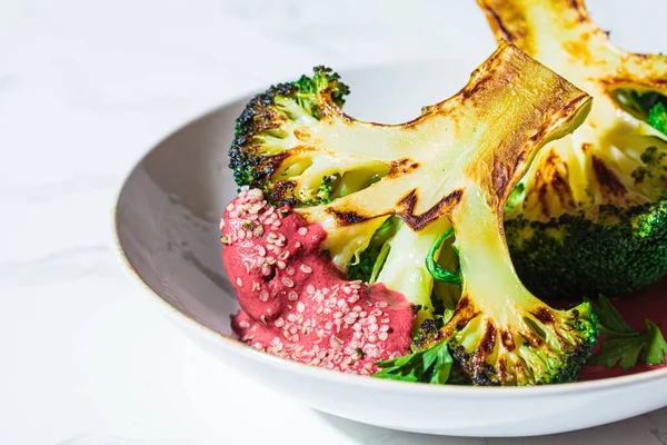Grilled Broccoli Steak Pink Beetroot Sauce Hemp Seeds White Bowl — Stock Photo, Image