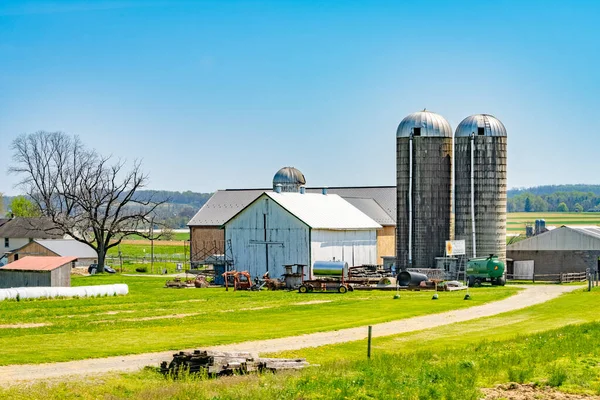 Amish country, farm, home and barn on field agriculture in Lancaster, Pennsylvania, PA US North America.