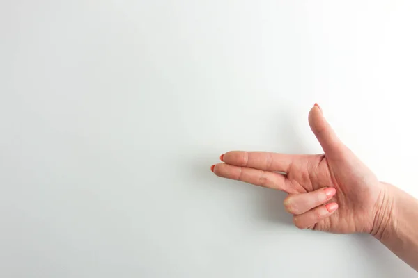 Mano Mujer Haciendo Gesto Pistola Apuntando Con Dos Dedos Fondo —  Fotos de Stock