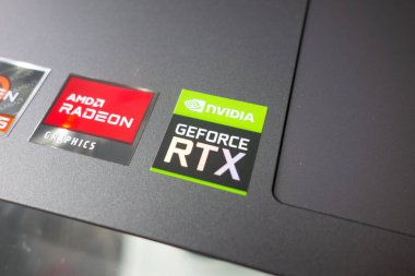 KONSKIE, POLAND - April 27, 2022: stickers with AMD Radeon and Nvidia GeForce RTX graphics on new laptop computer