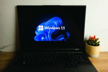 KONSKIE, POLAND - July 05, 2022: Microsoft Windows 11 operating system logo displayed on laptop computer screen