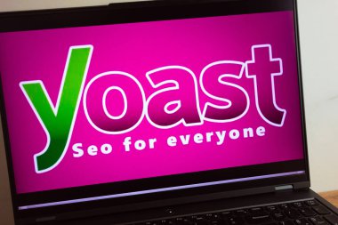 KONSKIE, POLAND - July 11, 2022: Yoast SEO search engine optimization plug-in logo displayed on laptop computer screen