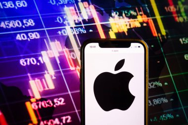 KONSKIE, POLAND - August 07, 2022: Smartphone displaying logo of Apple Inc American multinational technology company on stock exchange chart background