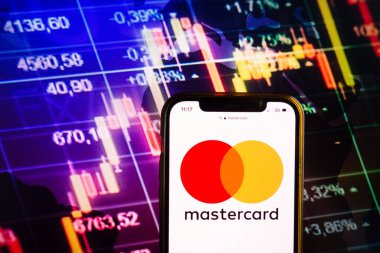 KONSKIE, POLAND - August 07, 2022: Smartphone displaying logo of Mastercard Inc on stock exchange diagram background
