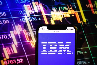 KONSKIE, POLAND - August 09, 2022: Smartphone displaying logo of IBM company on stock exchange diagram background