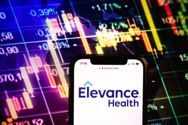 KONSKIE, POLAND - August 09, 2022: Smartphone displaying logo of Elevance Health company on stock exchange diagram background