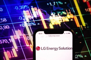 KONSKIE, POLAND - August 09, 2022: Smartphone displaying logo of LG Energy Solution company on stock exchange diagram background