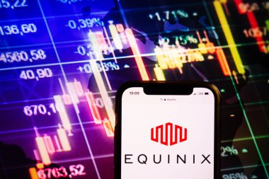 KONSKIE, POLAND - August 10, 2022: Smartphone displaying logo of Equinix company on stock exchange diagram background