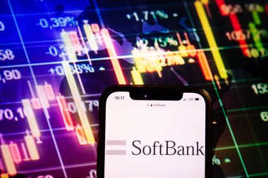 KONSKIE, POLAND - August 10, 2022: Smartphone displaying logo of SoftBank company on stock exchange diagram background