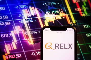 KONSKIE, POLAND - August 10, 2022: Smartphone displaying logo of Relx company on stock exchange diagram background