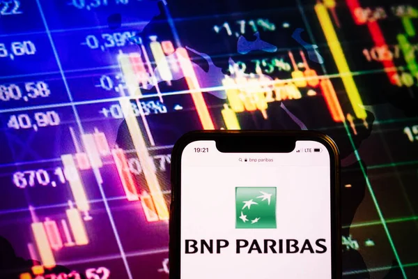 KONSKIE, POLAND - August 10, 2022: Smartphone displaying logo of BNP Paribas company on stock exchange diagram background