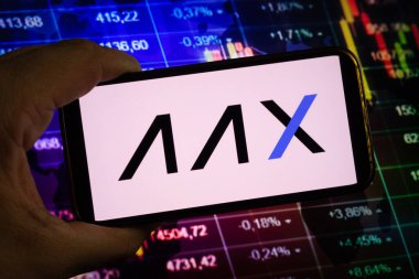 KONSKIE, POLAND - August 10, 2022: Smartphone displaying logo of AAX cryptocurrency exchange on stock exchange diagram background