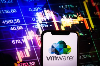 KONSKIE, POLAND - August 30, 2022: Smartphone displaying logo of Vmware company on stock exchange diagram background