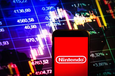 KONSKIE, POLAND - August 30, 2022: Smartphone displaying logo of Nintendo company on stock exchange diagram background