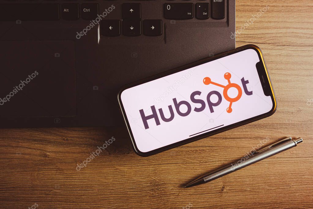 KONSKIE, POLAND - September 17, 2022: HubSpot logo displayed on smartphone screen in the office. HubSpot is an American developer and marketer of software products for inbound marketing, sales, and customer service