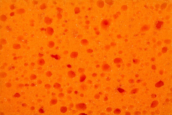 Esponja Porosa Naranja Brillante Con Burbujas Jabón Textura Para Creatividad — Foto de Stock