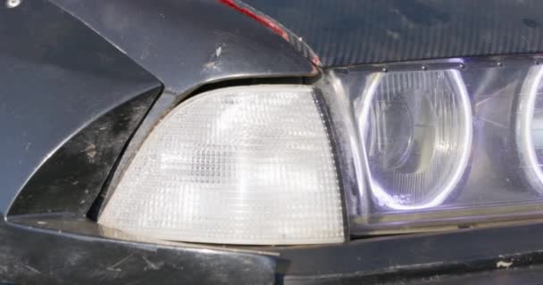 Black drift car with headlights on hood and radiator screen — Vídeo de Stock