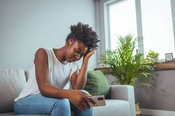 Sad young black woman portrait feeling negative emotions. Young girl in trouble feeling sad and depressed. Depressed African American Girl With Sad Emotions And Feelings