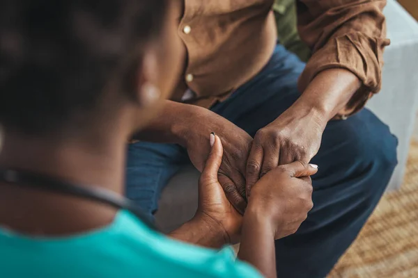 Female Healthcare Worker Holding Hands Senior Man Care Home Focus — Stock Photo, Image