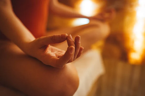 Beautiful blonde woman meditating in salt room. Cropped shot of an woman sitting in salt room and meditating alone. Finding my balance