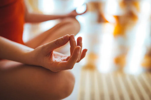 Beautiful blonde woman meditating in salt room. Cropped shot of an woman sitting in salt room and meditating alone. Finding my balance