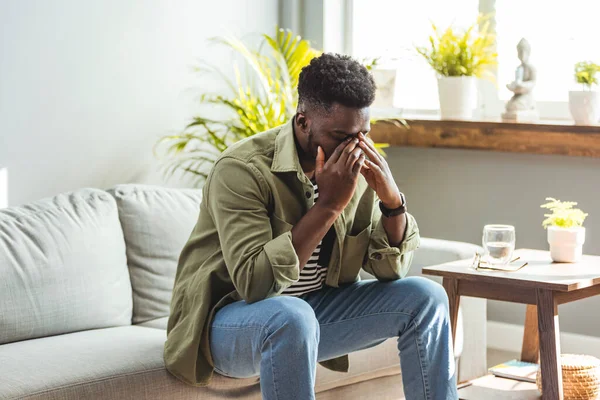 Young Man Suffering Headache Hard Working Day Sitting Couch Home — Foto de Stock