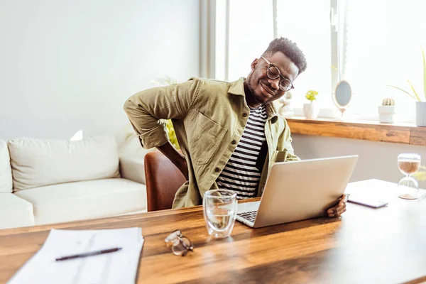 Cropped Shot Young Businessman Experiencing Back Pain While Working His — Zdjęcie stockowe