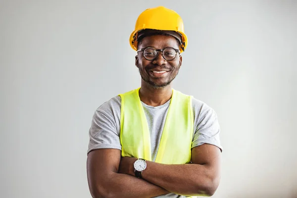 Happy African Builder Workman Standing Pleased Crossing Hands Posing Gray — Stockfoto