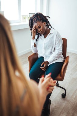 Psychology, depression. Sad, suffering asian young woman, consulting with psychologist, psychiatrist while patient counseling mental problem with doctor at clinic. Encouraging, therapy, health care.