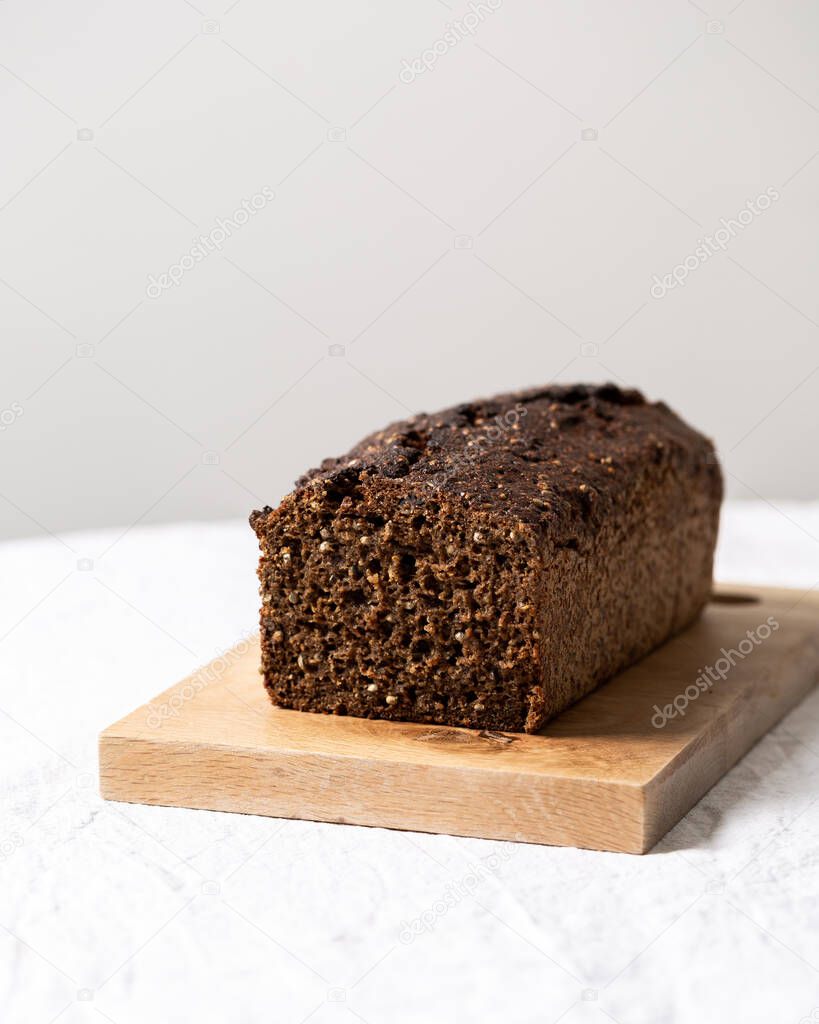 Loaf of bread on sourdough from rye flour with seeds