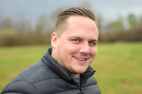 Portrait Young Man Looking Camera Quiet Smile Outdoors Park Cold — Stock Photo, Image