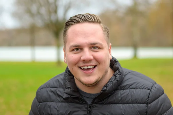 Laughing Happy Young Man Autumn Park Head Shoulders Portrait Looks — Stock Photo, Image