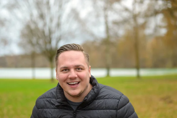 Laughing Happy Young Man Autumn Park Head Shoulders Portrait Looks — Stock Photo, Image