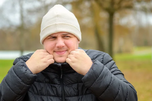 Cold Young Man Wearing Knittted Woollen Beanie Snuggling Warm Jacket — Stockfoto