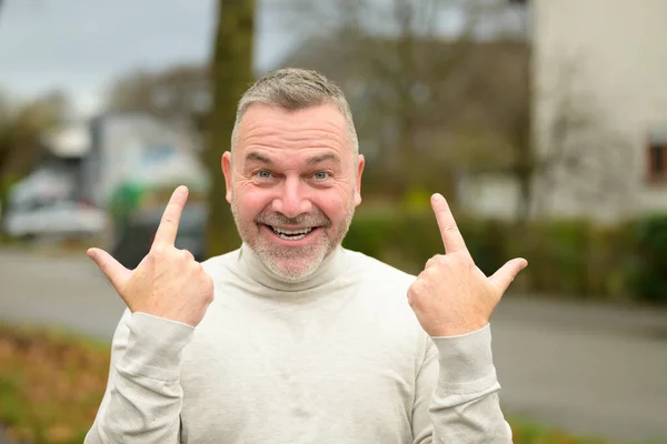 Gleeful Elated Man Grinning Camera While Gesturing Both His Hands — Stock Photo, Image