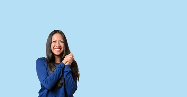 Happy Young Woman Beautiful Smile Clasped Hands Posing Blue Background — Stockfoto
