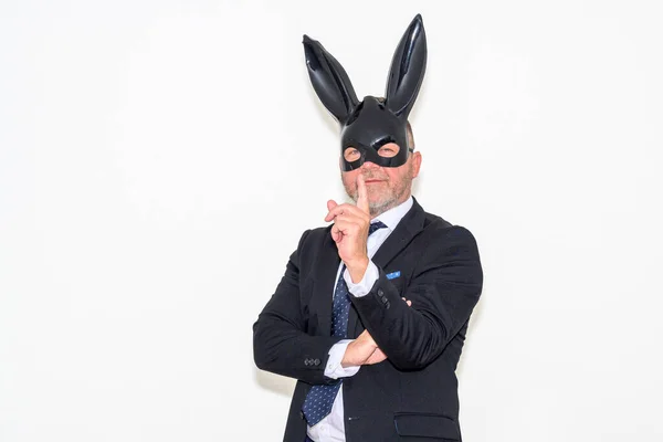 Kinky Businessman Wearing Bunny Mask Gesturing Camera Quiet Smile White — стоковое фото