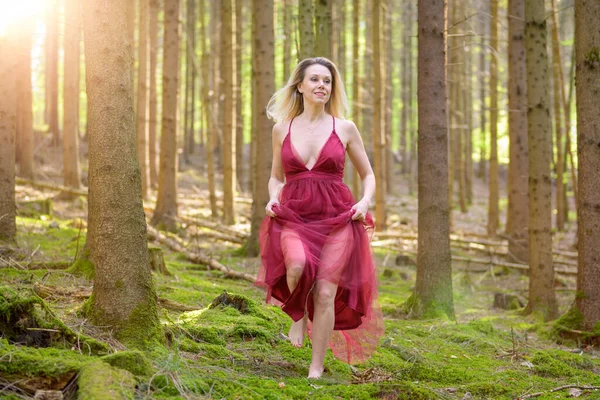 Attractive Woman Wearing Magenta Sexy Dress Looking Away While Running — 스톡 사진