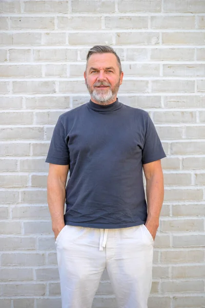 Trendy Casual Middle Aged Man Posing Front Brick Wall Relaxed — Stockfoto