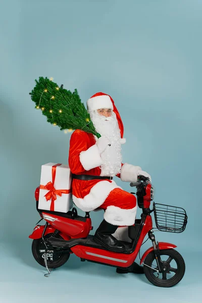 Santa Claus Red Electric Moped Holds Artificial Christmas Tree Burning Fotos De Bancos De Imagens Sem Royalties