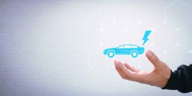 Elektrikli araç seçiyorum. Elektrikli ve benzinli araba seçimi. Şarj makinesindeki sembolü göstererek.