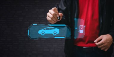 Choosing an electric vehicle. electric car choice. pointing at symbol on charging machine. electric car production