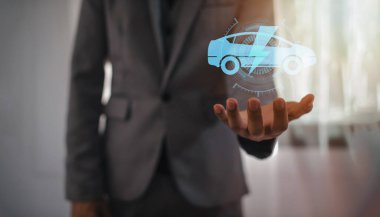 Choosing an electric vehicle. electric car choice. pointing at symbol on charging machine. electric car production
