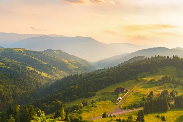 Elevated View Mountainous Green Scene Distant Buildings Sunset Sky — Foto Stock