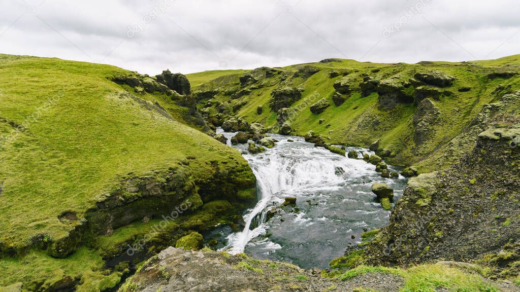 River in Iceland, Europe. Amazing view for green meadow and water. Landscape photography, copy space background.
