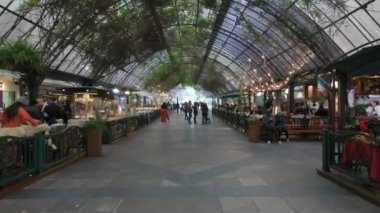Gramado, RS, Brazil - May 17, 2022: walking on Rua Coberta street, a covered street with restaurants and shops. Tourist destination of Gramado.