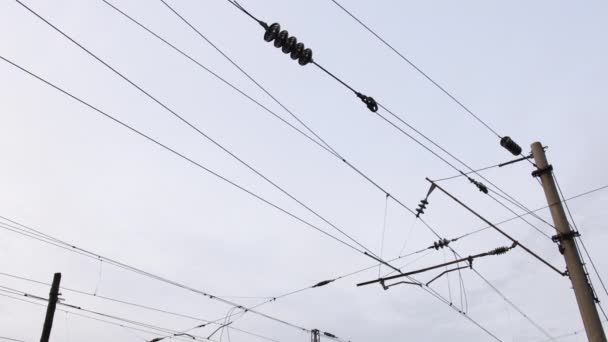 Electric wires on the railway. Transmission lines. View below. railway electric — 图库视频影像